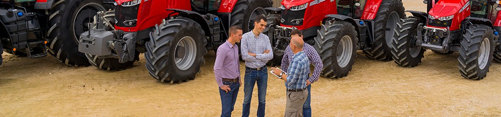 An AGCO dealer shakes hands with one of our valuable customers.